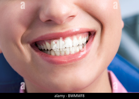 Close-up of happy female showing her healthy teeth in smile Stock Photo