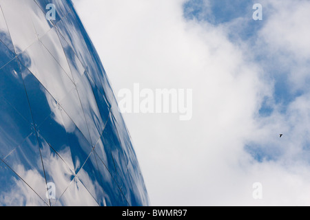 Clouds reflecting in giant silver globe at Cite des sciences, Paris France Stock Photo