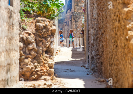 Children in an alleyway Pate Town, Lamu Island, Kenya Stock Photo