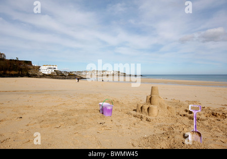 Sand castles at low tide on Porthminster beach in Cornwall, looking over to St Ives Stock Photo