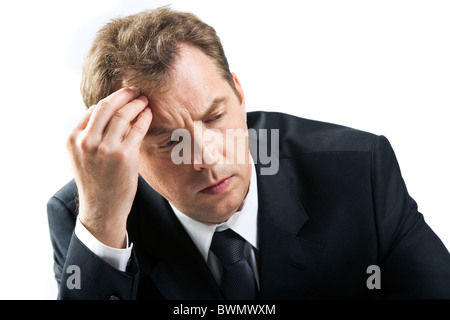 Photo of stressed businessman touching his head while thinking Stock Photo