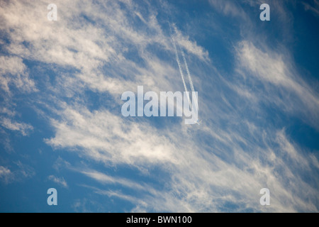 A jet flying through high level cloud. Stock Photo