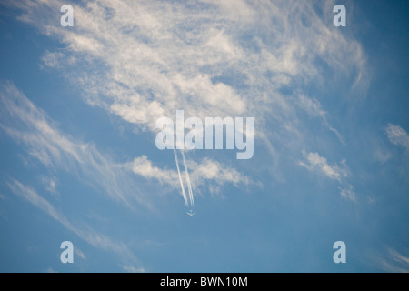 A jet flying through high level cloud. Stock Photo