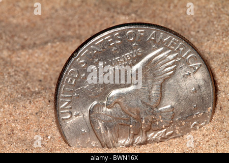 quarter in the sand Stock Photo