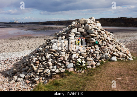 This cairn is a memorial to the dead, flowers have been placed to remember people's dead mothers on Mother's Day. DAVID MANSELL Stock Photo