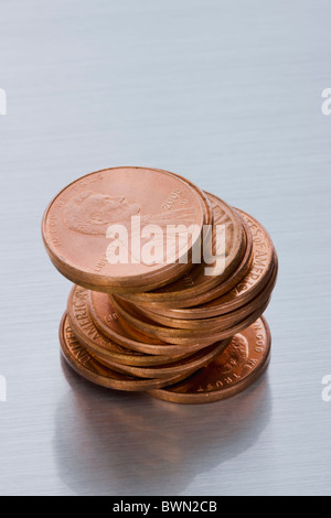 A stack 1 US cent (penny) coins isolated on white background. This is ...