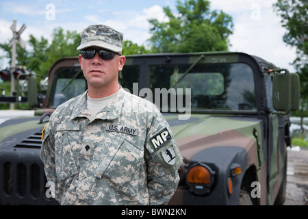 USA, Missouri, Portrait of US soldier standing in front of hummer Stock Photo