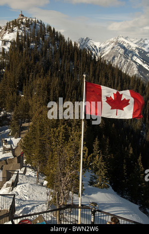 Canadian flag flying atop Sulphur Mountain, Banff National Park, Banff, Alberta, Canada. Stock Photo