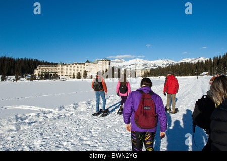 Snowshoeing at Chateau Lake Louise Hotel, Lake Louise, Banff National Park, Alberta, Canada. Stock Photo