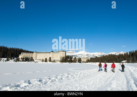 Snowshoeing at Chateau Lake Louise Hotel, Lake Louise, Banff National Park, Alberta, Canada. Stock Photo