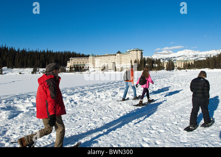 Snowshoeing at Chateau Lake Louise Hotel, Lake Louise, Banff National Park, Alberta, Canada. Stock Photo