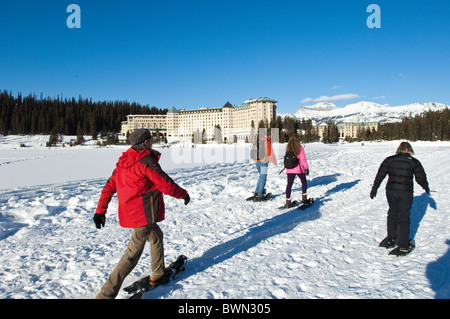 Snowshoeing at Chateau Lake Louise Hotel, Lake Louise, Banff National Park, Alberta, Canada. Stock Photo