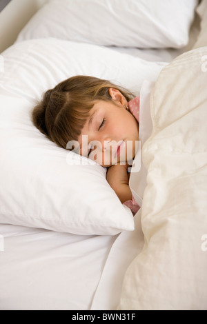 Girl sleeping on bed Stock Photo - Alamy