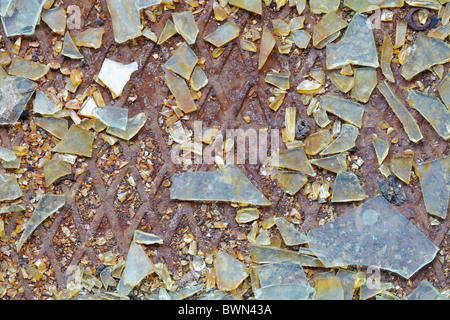 Dirty industrial background - broken glass on the steel floor Stock Photo