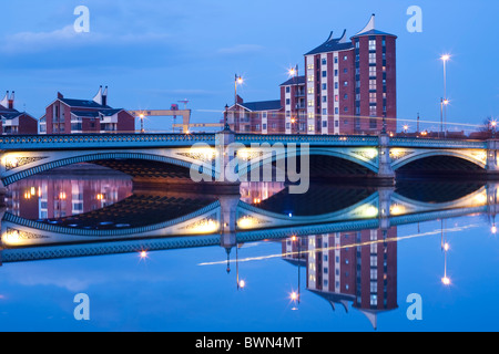 The Albert Bridge at dusk reflected in the waters of the River Lagan, Belfast, Northern Ireland Stock Photo