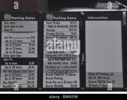 Parking rates posted on side of a garage in New York Stock Photo