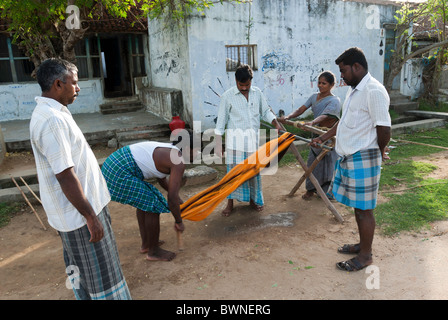 Drying silk yarn ; Kanchipuram; kancheepuram ,Tamil Nadu,India. old tradition practiced by weavers in their homes . Stock Photo