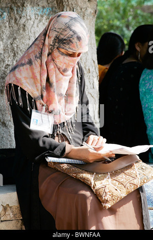 A student sits reading at the all female Fatima Jinnah University in Rawalpindi, Pakistan Stock Photo