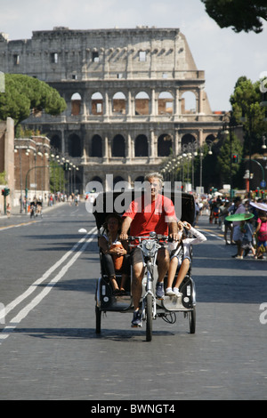 tourists in a rickshaw taxi by the colosseum, rome
