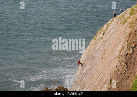 Baggy Point, Climbers on cliffs Stock Photo