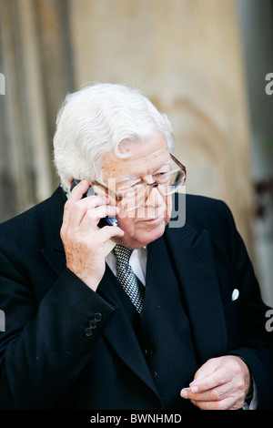 Sir Geoffrey Howe, former Conservative Foreign Secretary, chats on his mobile phone outside St Paul's Church in Knightsbridge Stock Photo