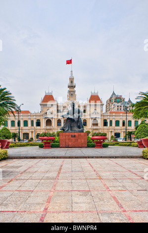 Uncle Ho statue in Saigon. Ho Chi Minh City Hall was built in the early ...