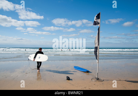 A Surfer in Fistral beach, Newquay, Cornwall, UK Stock Photo