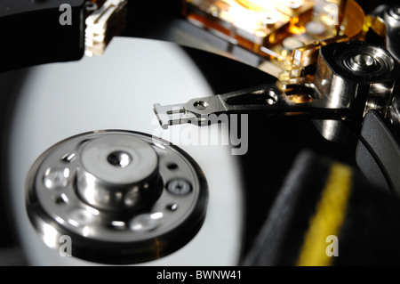 Hard disk drive with rotating pindel and heads in reading position Stock Photo