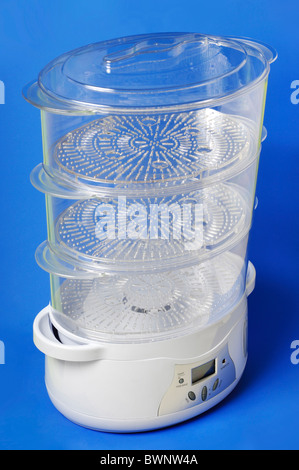 Multi-Tier Food Steamer isolated on blue background Stock Photo