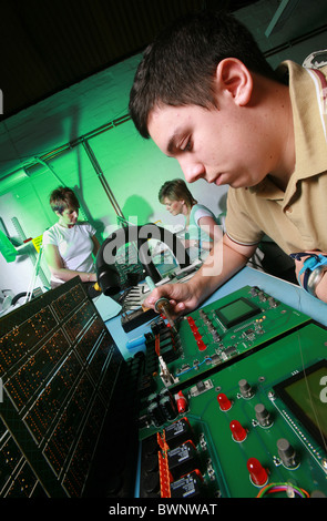 young male worker in electronics factory Stock Photo