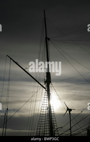Modern wind turbine and mast of the Royal Research Ship 'Discovery' . Dundee, Tayside, Scotland. Stock Photo