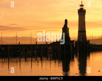 Germany Europe Bavaria Lindau Lake Constance Bodensee Lighthouse Harbor harbor Dusk Dawn Silhouette Lion Stock Photo