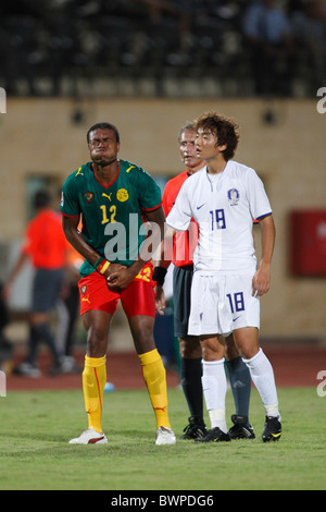 Adolphe Teikeu of Cameroon holds groin after being shaken up during a 2009 FIFA U-20 World Cup Group C match against South Korea Stock Photo