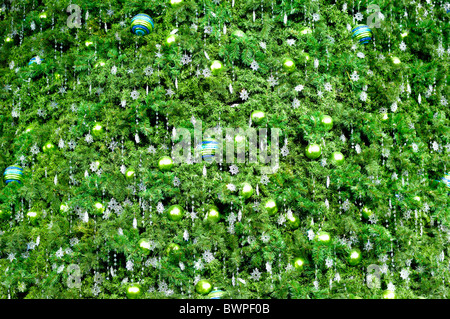 Decorated Christmas tree abstract green background Stock Photo