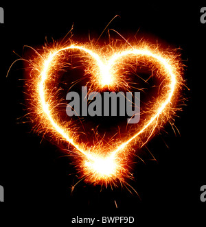 Sparkling heart shape isolated on black background Stock Photo