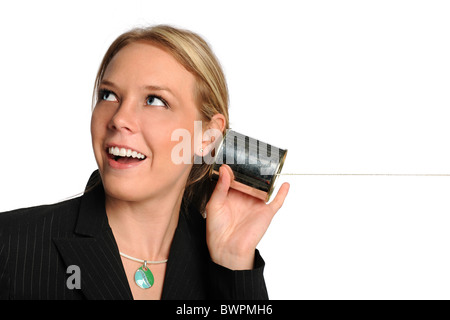 Portrait of businesswoman using tin can phone isolated over white background Stock Photo