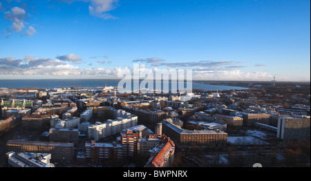 View over the city of Tallinn in Estonia towards the Baltic sea showing the modern parts of the town and the port Stock Photo