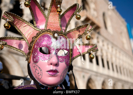 A Venetian carnival's mask at a stall outside the doge's palace. Stock Photo