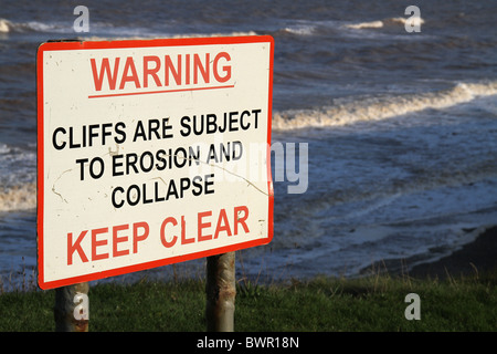 Cliff danger erosion warning sign. Stock Photo
