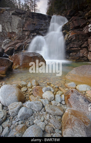Icy cold waterfall at Obravsky Vodopad in the High Tatra Mountains of Slovakia Stock Photo