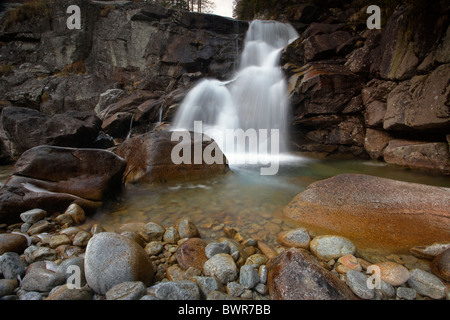 Icy cold waterfall at Obravsky Vodopad in the High Tatra Mountains of Slovakia Stock Photo