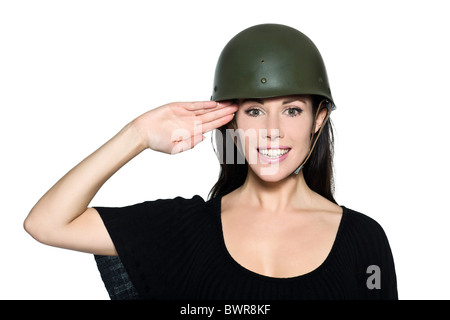 beautiful woman with helmet army soldier saluting on studio isolated background Stock Photo