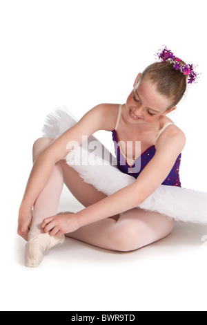 Studio shot of beautiful young ballet dancer in purple tutu Stock Photo