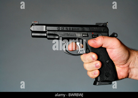 9 mm 9mm person adult adults assassin Close-up danger dangerous detail finger fingers firearm firearms g Stock Photo