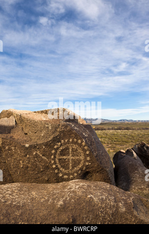 Petroglyph with circle and dot motif made by the Jornada Mogollon tribe at the Three Rivers Petroglyph Site, New Mexico USA. Stock Photo