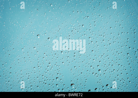 Blue background with tiny droplets of water Stock Photo - Alamy