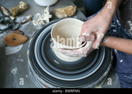 Pottery Ceramic Potteries Creativ Hands Woman Shaping Wheel Handwork Work Working Female potter Stock Photo