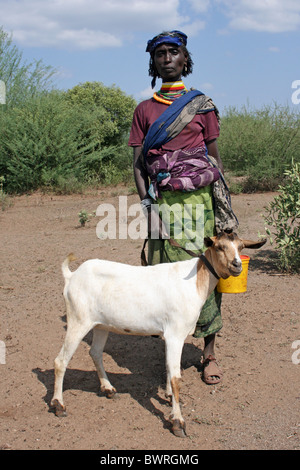 A Mature Borana Tribe Woman With Her Goat, Ethiopia Stock Photo