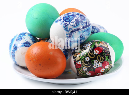 Multi-colored eggs on a plate. Easter holiday Stock Photo