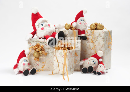 Christmas gifts and five gnomes isolated on white background Stock Photo